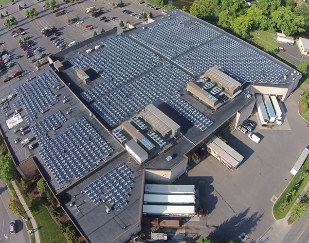 Drone shot of a large flat roof solar panel system